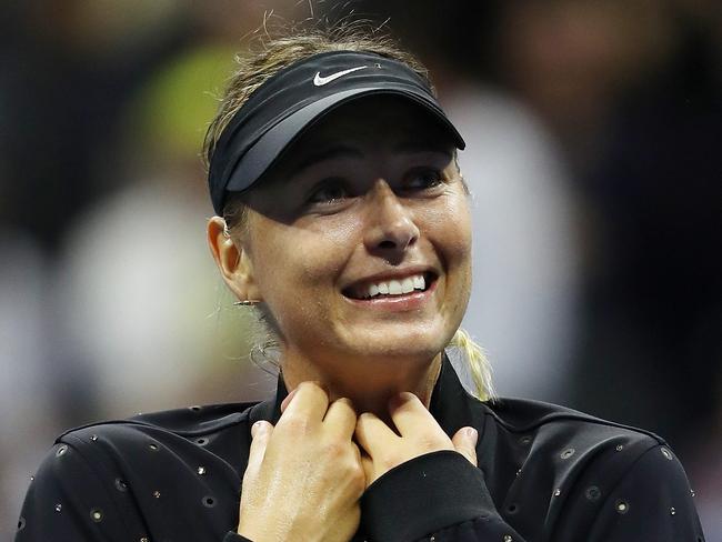 NEW YORK, NY - AUGUST 28: Maria Sharapova of Russia celebrates winning her first round Women's Singles match against Simona Halep of Romania on Day One of the 2017 US Open at the USTA Billie Jean King National Tennis Center on August 28, 2017 in the Flushing neighborhood of the Queens borough of New York City.   Elsa/Getty Images/AFP == FOR NEWSPAPERS, INTERNET, TELCOS & TELEVISION USE ONLY ==