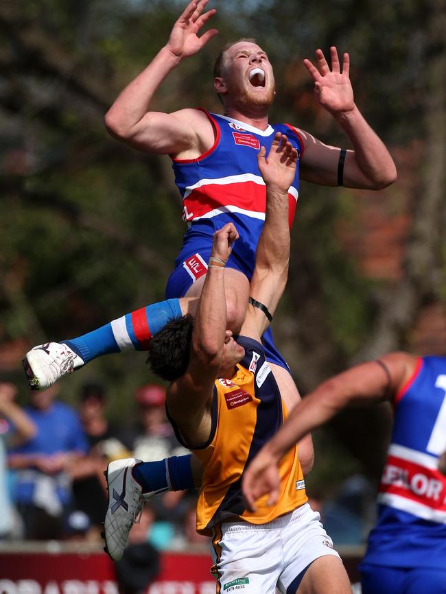 Keilor ruckman Andrew Browne flies for a mark against Strathmore. Picture: Mark Dadswell.