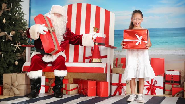 Edie Docherty, 7, is pleased Santa can enter NSW this Christmas. Picture: Richard Dobson