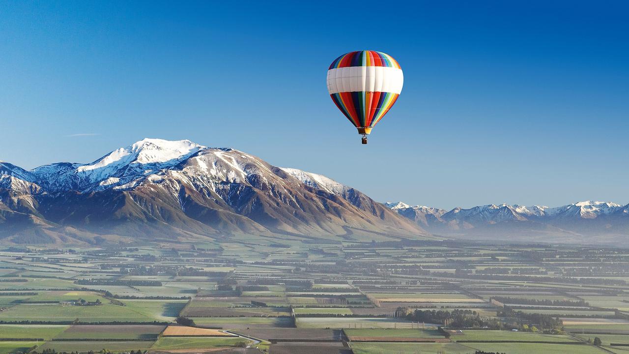 TOURISM NZ / ESCAPE: SOUTH ISLAND SPECIAL .. Hot-air Balloon, near Methven, Canterbury Plains, South Island, New Zealand - aerial