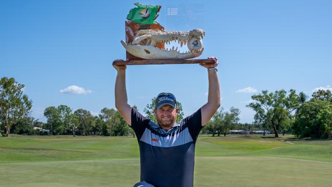 True Blue ... Aaron Pike with the unique Crocodile Trophy he received as the 2020 NT PGA champion. Picture: Taylah Somerville