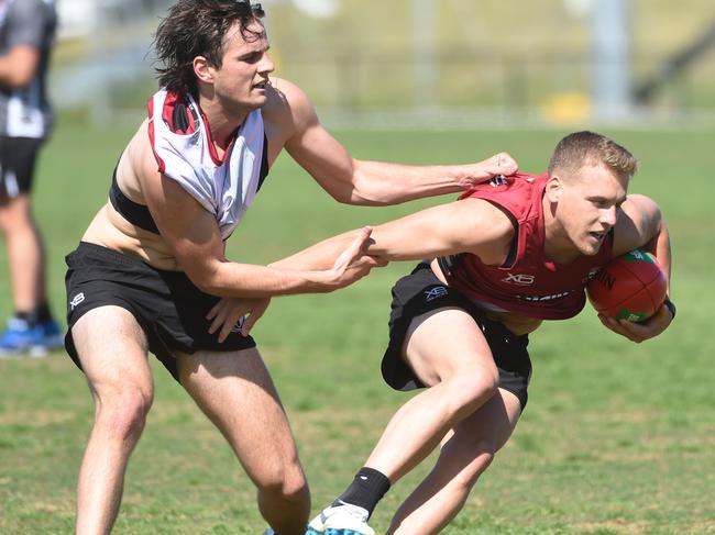 Nathan Lonie tries to break a tackle. Picture: Tony Gough