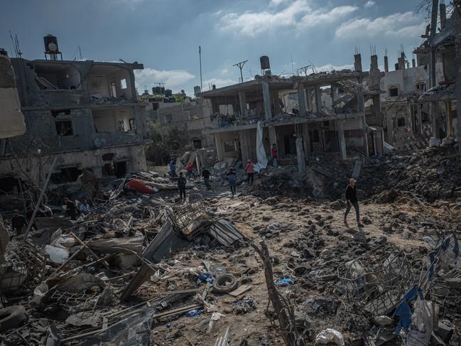 People inspect the damage done to Beit Hanoun after a night of Israeli raids in Gaza. Picture: AFP