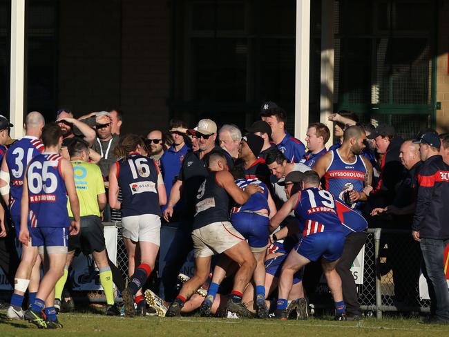 Players tangle after the final siren at Keysborough. Picture: Stuart Milligan