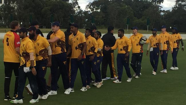 Happy Hawks: the Kingston Hawthorn players come off the ground after defeating St Kilda.