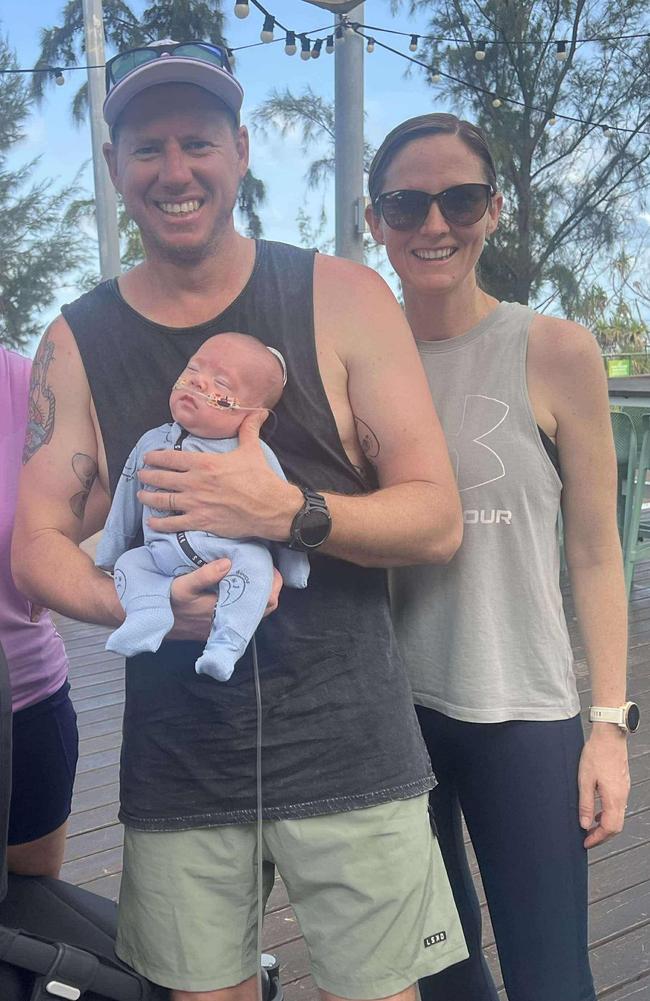 Darren and Amanda Minchin pictured with their son Sully during a run for Steps for Sully. Picture: Supplied.