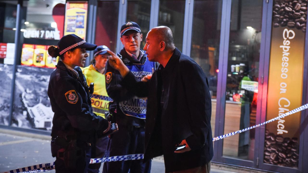 A man argues with police in front of the building at Mascot. Picture: Daily Telegraph/Flavio Brancaleone.