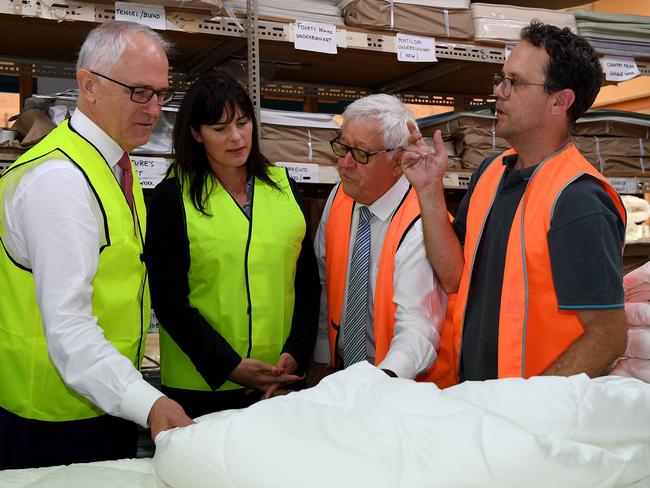 Prime Minister Malcolm Turnbull along with Federal Member for Robertson Lucy Wicks tour the Bambi Enterprises factory with co-owner Peter Witney and managing Director Greg Witney (AAP Image/Dan Himbrechts)