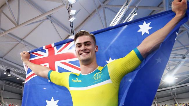 Matt Glaetzer celebrates a gold medal and Games record time in the Men's 1000m Time Trial.