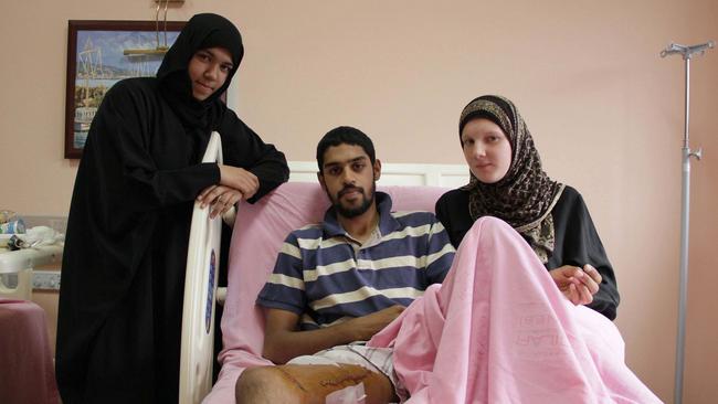 Ahmed Luqman Talib (centre) who recovered from surgery for bullet wounds in the Istanbul hospital, with his sister Maryam Luqman (left) and wife Jerry Campbell (right) in June 2010. Picture: © Headpress