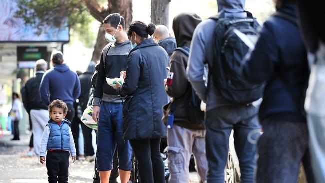 Long lines of financially struggling workers grow outside the Darlinghurst Centrelink branch in Sydney. Picture: Jane Dempster/The Australian.