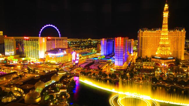 Aerial view of Las Vegas Strip resorts and casinos at night.