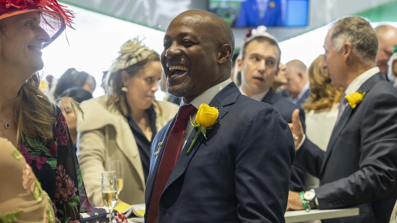 Brian Lara doing his best work in the Birdcage at the Melbourne Cup. Lara will be a part of the Triple M commentary team this summer. Picture: Wayne Taylor/Getty Images for VRC)