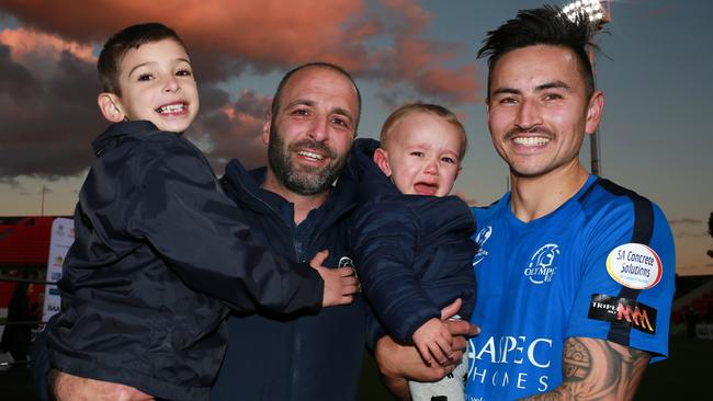 Man-of-match Matt Halliday and president Stavros Parissos celebrate Adelaide Olympic’s FFA Cup SA triumph with families. Picture: AAP/Emma Brasier