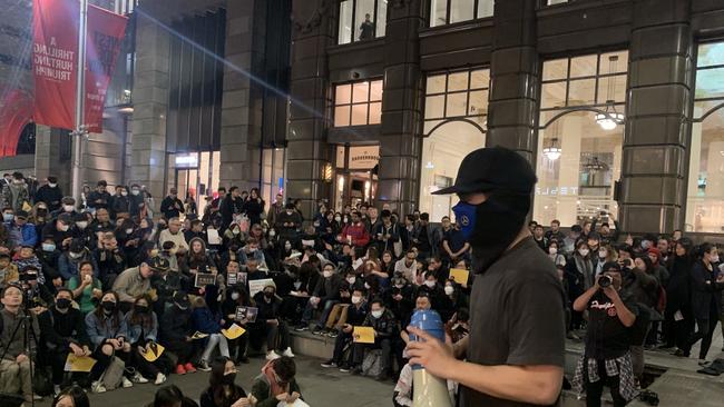 Hundreds of people wearing masks and black clothing have joined in the protest to show solidarity with the protesters in Hong Kong. Picture: Campbell Gellie