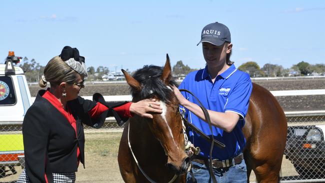 ON DEBUT: William Kropp (pictured strapping Droplet for father Matt), will make his training debut today at Dalby. Photo: Glen McCullough