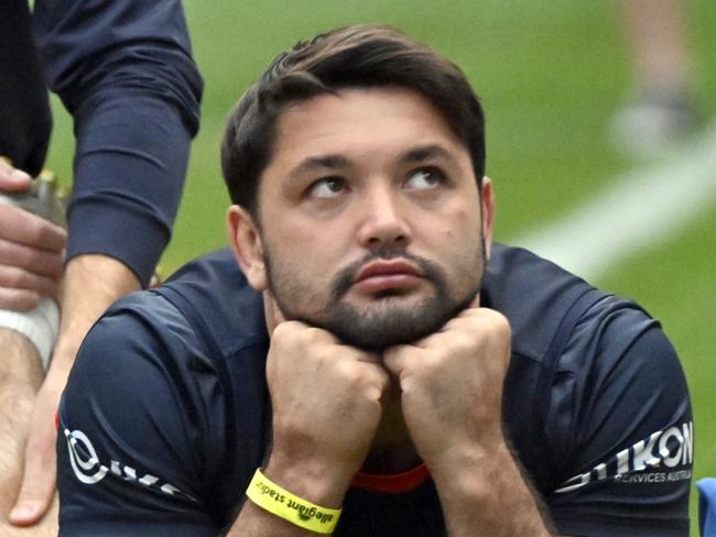 Sydney Roosters forward Brandon Smith is stretched out by a trainer before the captainÃs run at Allegiant Stadium on Friday, March 1, 2024, in Las Vegas. (Photo by David Becker)