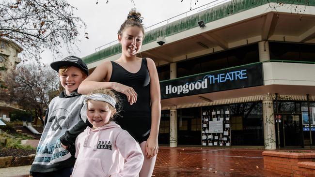 Dance Xtreme students Jesse Ellis, 9, Zara Ellis 3, and Tamzyn Huber, 13, outside the Hopgood Theatre in Noarlunga, which is facing funding issues and at risk of closing. AAP Image/ Morgan Sette.