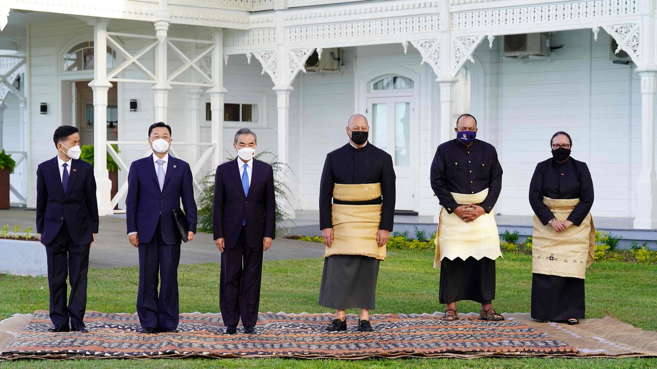 King Tupou VI of Tonga (3rd R) and Chinese Foreign Minister Wang Yi (3rd L) pose for pictures with Tonga Prime Minister Hu’akavameiliku (2nd R), Foreign Minister Fekita Utoikamanu (R) and China Ambassador to Tonga Cao Xiaolin (L) at the Royal Palace. Picture: Linny Folau / MatangiTonga / AFP