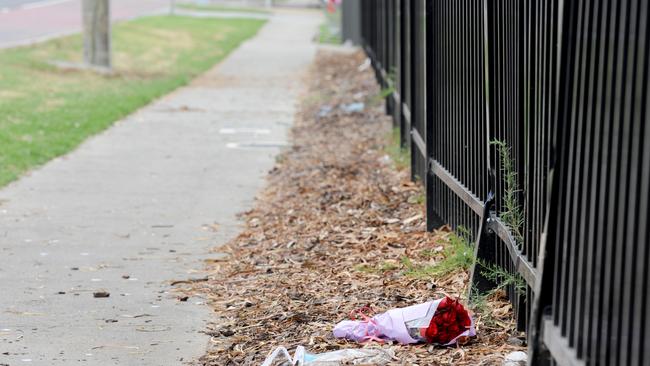 Roses left along Stud Rd in memory of the teen. Picture: Andrew Henshaw