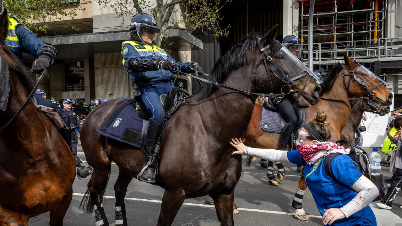 Police mounted unit clash with protesters on the Clarendon Street Bridge. Picture: Jake Nowakowski