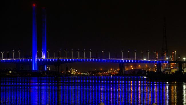 The Bolte Bridge bathed in blue last year in honour of four Victoria Police officers who lost their lives in a horrific motor vehicle accident on the Eastern Freeway. Picture: Mark Stewart