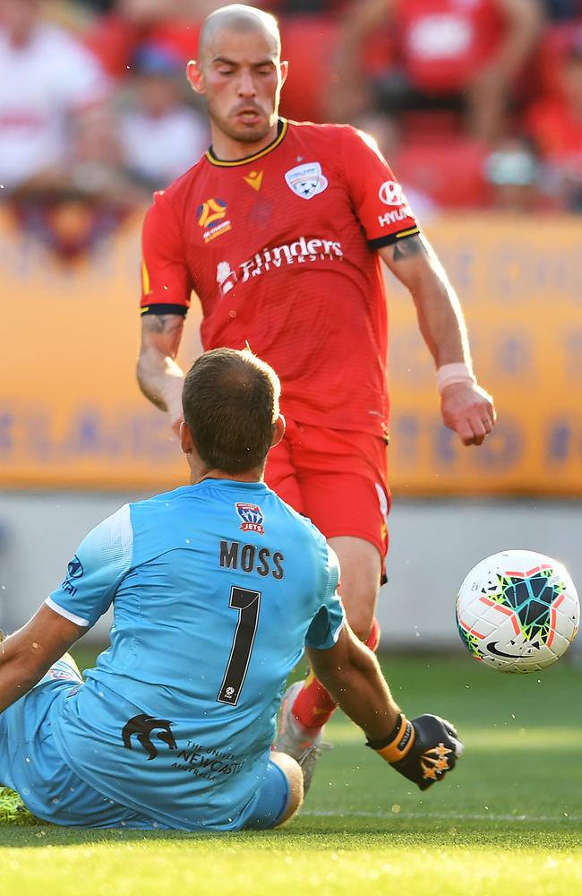 Troisi scores past Newcastle goalkeeper Glen Moss.