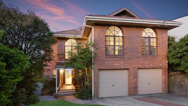 Four bidders participated in the auction for the home on Plunkett Road, Mosman, with the winners bidding $16.3m