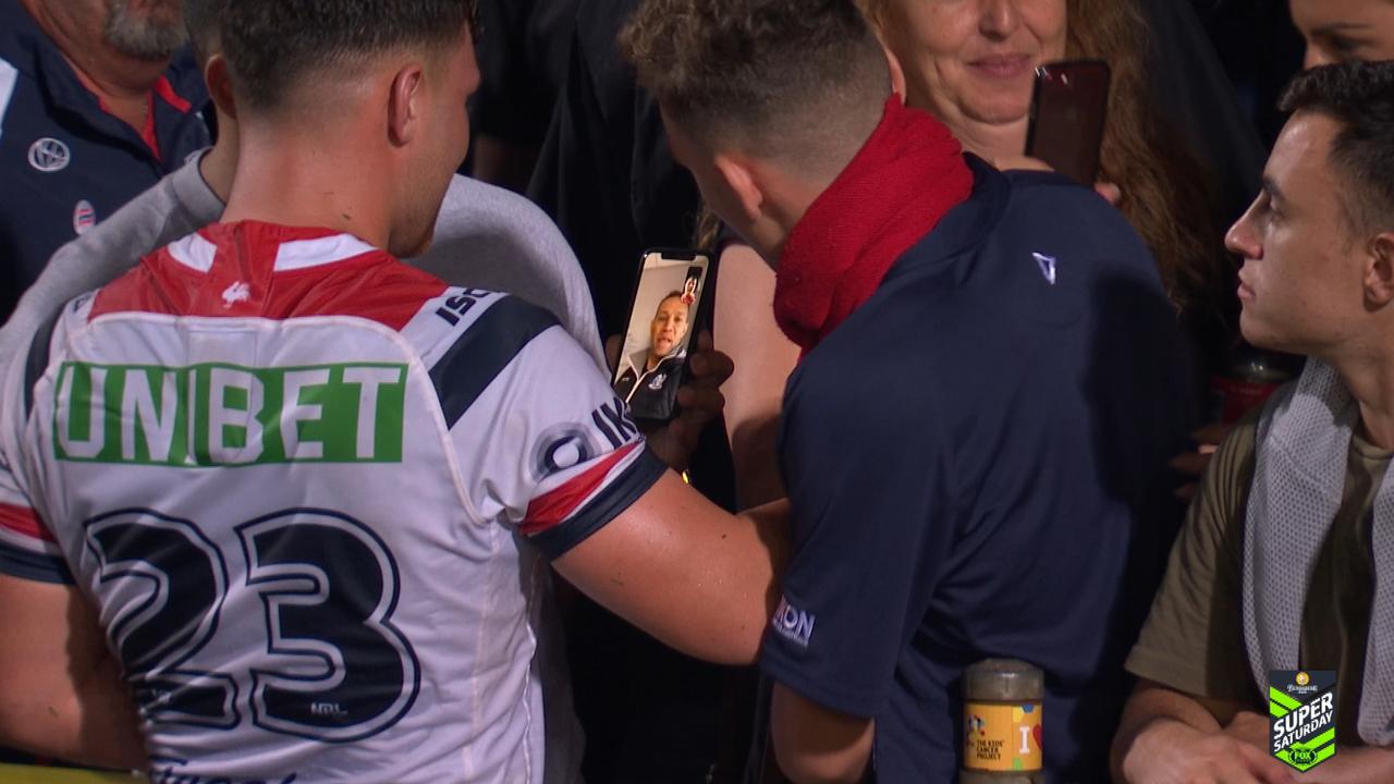Lachlan Lam Facetimes his dad, after a dream debut for the Roosters. 