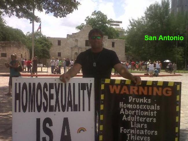 An American street preacher carrying the same sign at the centre of the Israel Folau sacking.