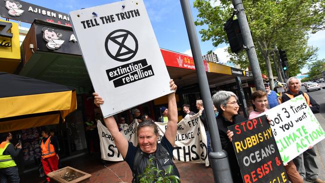 Activists from Extinction Rebellion take their message to the streets. Picture: AAP Image/David Mariuz