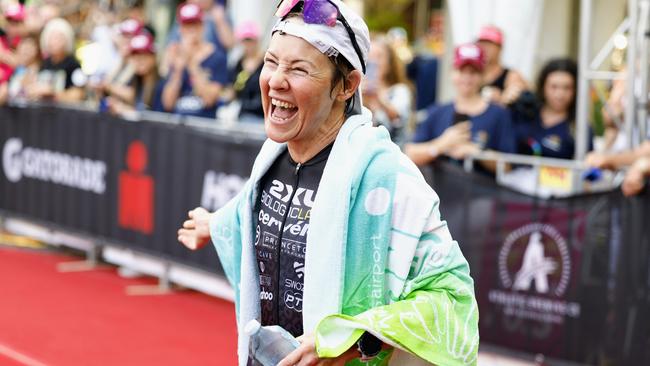 Kylie Simpson crosses the finish line on the Cairns Esplanade to win the Ironman Cairns Asia Pacific Championship race. Picture: Brendan Radke