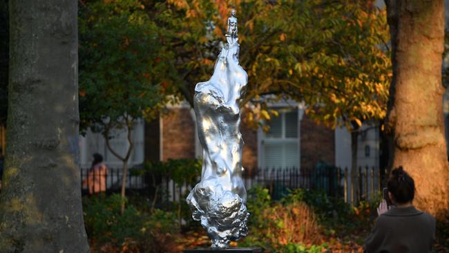 A woman photographs the sculpture honouring 18th century British author and feminist icon Mary Wollstonecraft in north London's Newington Green. Picture: Justin Tallis/AFP