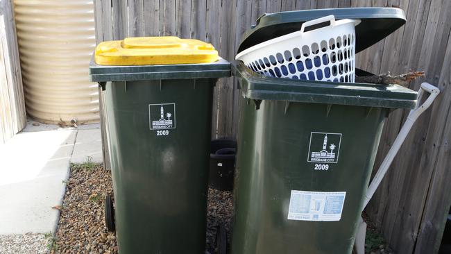 Currently residents could only throw food scraps in general waste (right) or compost it in their own backyards. Picture: File.