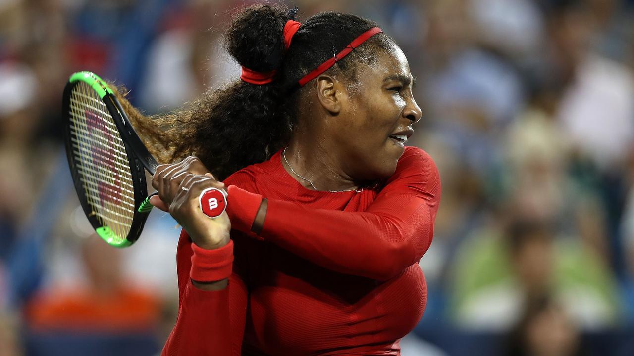 Serena Williams returns a shot to Petra Kvitova.