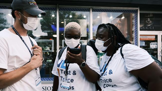 NEW YORK CITY - JULY 26: Members of the Test and Trace Corps walk the streets of Brooklyn passing out masks and trying to sign people up for the Covid-19 vaccine. Picture: AFP.