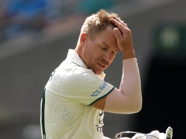 PERTH, AUSTRALIA - DECEMBER 16: David Warner of Australia looks dejected after being dismissed by Khurram Shahzad of Pakistan during day three of the Men's First Test match between Australia and Pakistan at Optus Stadium on December 16, 2023 in Perth, Australia (Photo by Paul Kane/Getty Images)