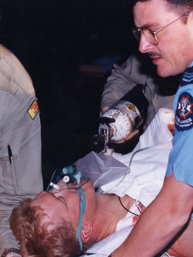 Senior Constable Derrick McManus with paramedics after he was shot by Tony Grosser in 1994.