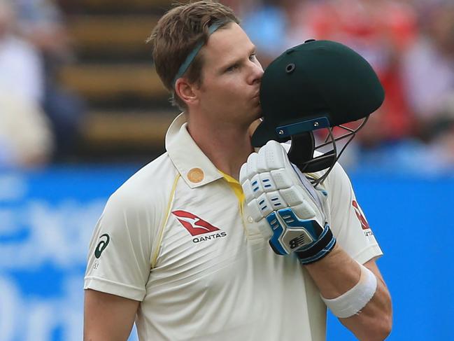 Australia's Steve Smith kisses his helmet as he celebrates reaching his century during play on the fourth day of the first Ashes cricket Test match between England and Australia at Edgbaston in Birmingham, central England on August 4, 2019. (Photo by Lindsey Parnaby / AFP) / RESTRICTED TO EDITORIAL USE. NO ASSOCIATION WITH DIRECT COMPETITOR OF SPONSOR, PARTNER, OR SUPPLIER OF THE ECB