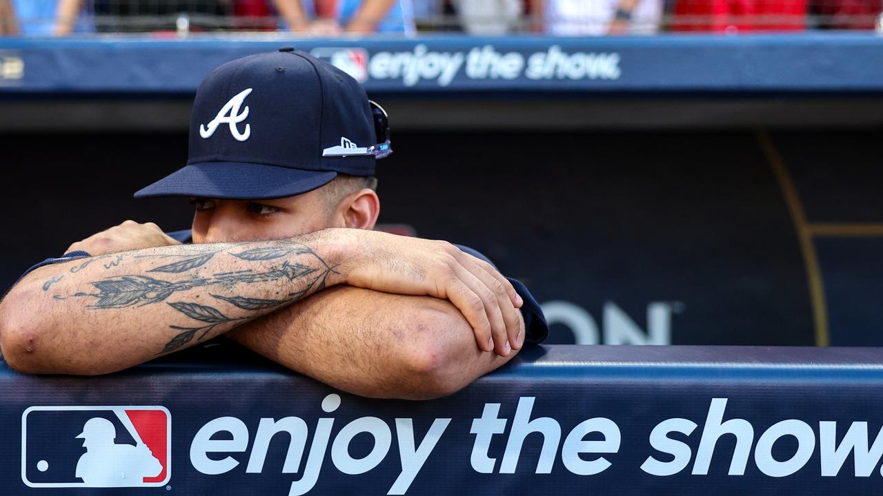The Braves' Vaughn Grissom stands in the dugout rejected after losing to the Philadelphia Phillies in the NLDS.  (Photo by Patrick Smith/Getty Images)