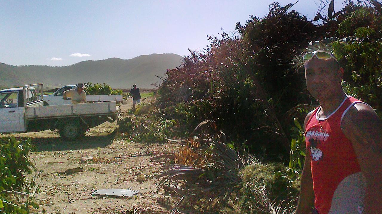 Ricky Duivailala unloads a trailer of greenwaste at Rockhampton landfill.