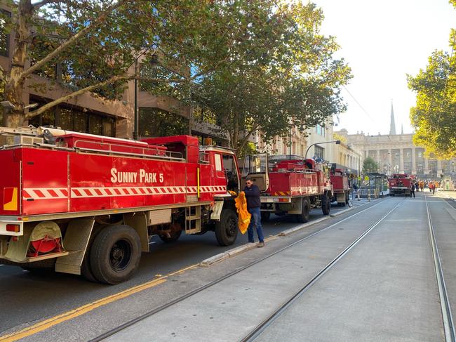 A convoy of CFA trucks makes its way to Victoria's parliament to protest the new emergency services levy. Picture: Regan Hodge