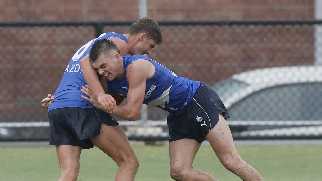 Colby McKercher tackles Harry Sheezel at training. Picture: Michael Klein