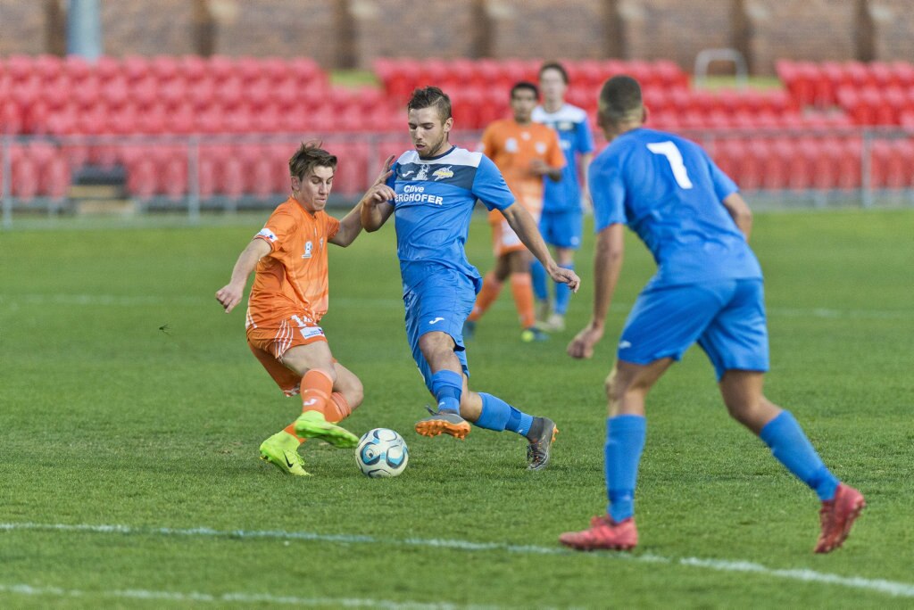 Ryan Cavanah (left) of Cairns FC and Anthony Grant of South West Queensland Thunder in NPL Queensland men round 26 football at Clive Berghofer Stadium, Saturday, August 25, 2018. Picture: Kevin Farmer