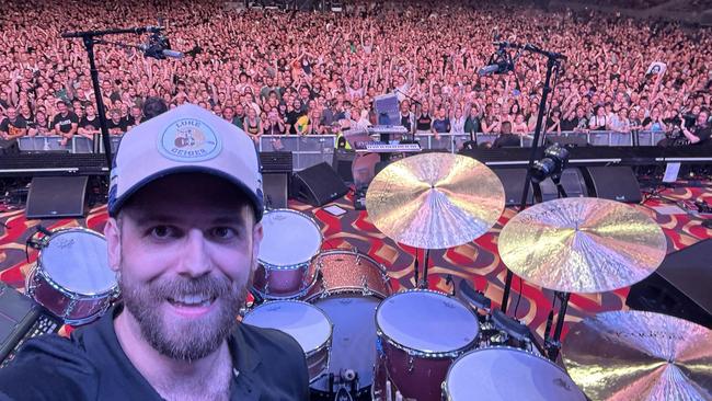 Tim McClelland, who plays drums for country singer Luke Geiger, on stage with The Killers in front of 18,000 concertgoers in Townsville on Saturday night. Picture: Supplied