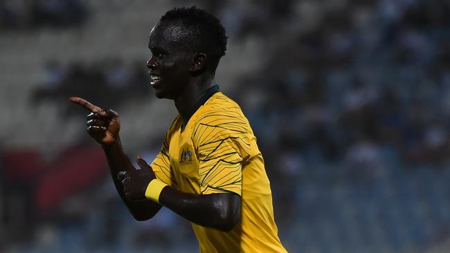 Awer Mabil celebrates scoring a goal on debut for Australia against Kuwait. Picture: Getty Images