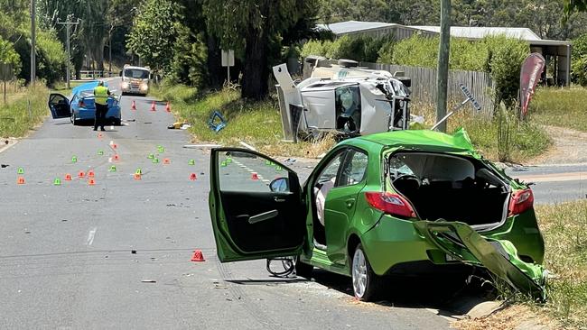 A woman driving a green car was killed in a collision with a blue car and a Toyota HiLux with a horse float at the intersection of Queens Rd and Beenak Rd in Seville about 8am on Tuesday. Picture: Kiel Egging.