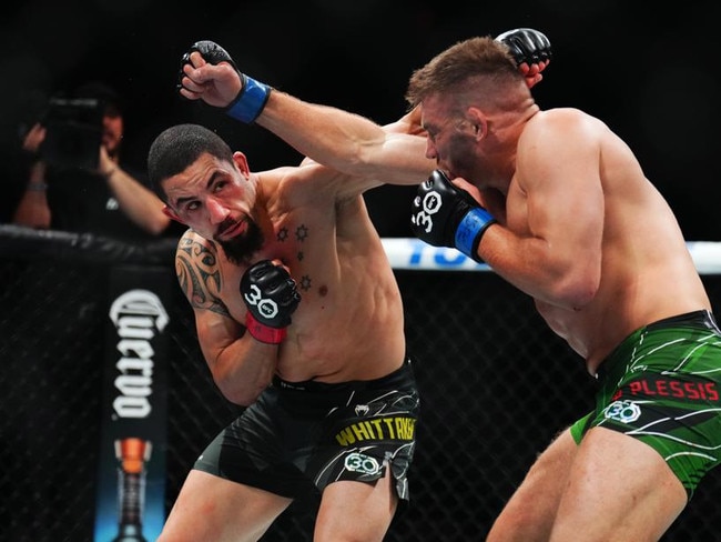 Robert Whittaker trades punches with Dricus du Plessis in 2023. Picture: Chris Unger/Zuffa LLC via Getty Images