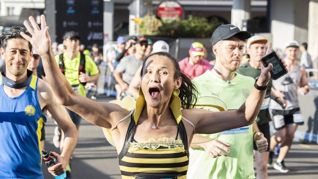 Attendees cross the Sydney Marathon starting line at Milsons Point. Picture: NCA NewsWire / Monique Harmer