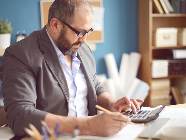 Mature Adult man working in the office